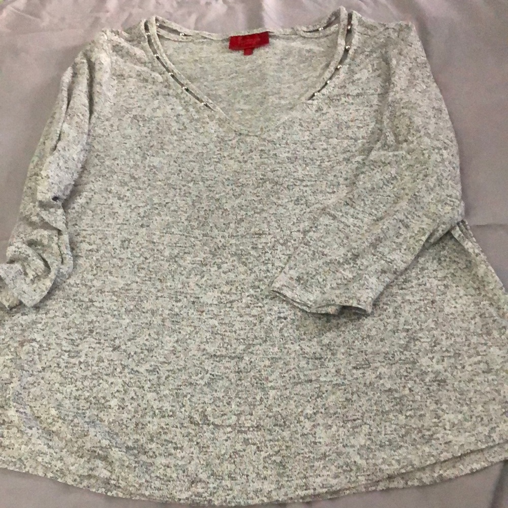 J Lo design very cute top with metal silver ball accents on the v-neck.